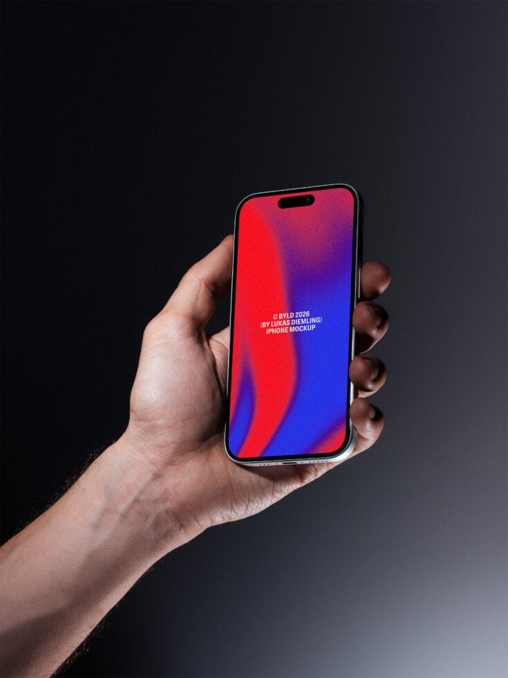 Hand holding iPhone with red to blue gradient screen on dark background