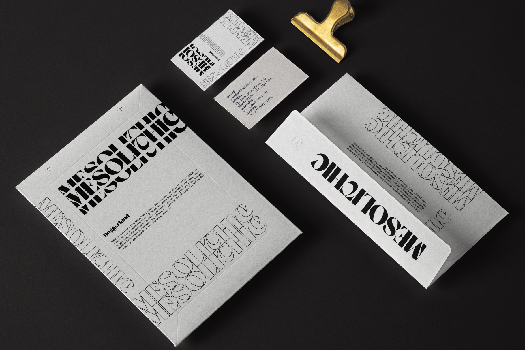 Minimalist branding mockup with letterhead, business cards, gold stamp on dark background