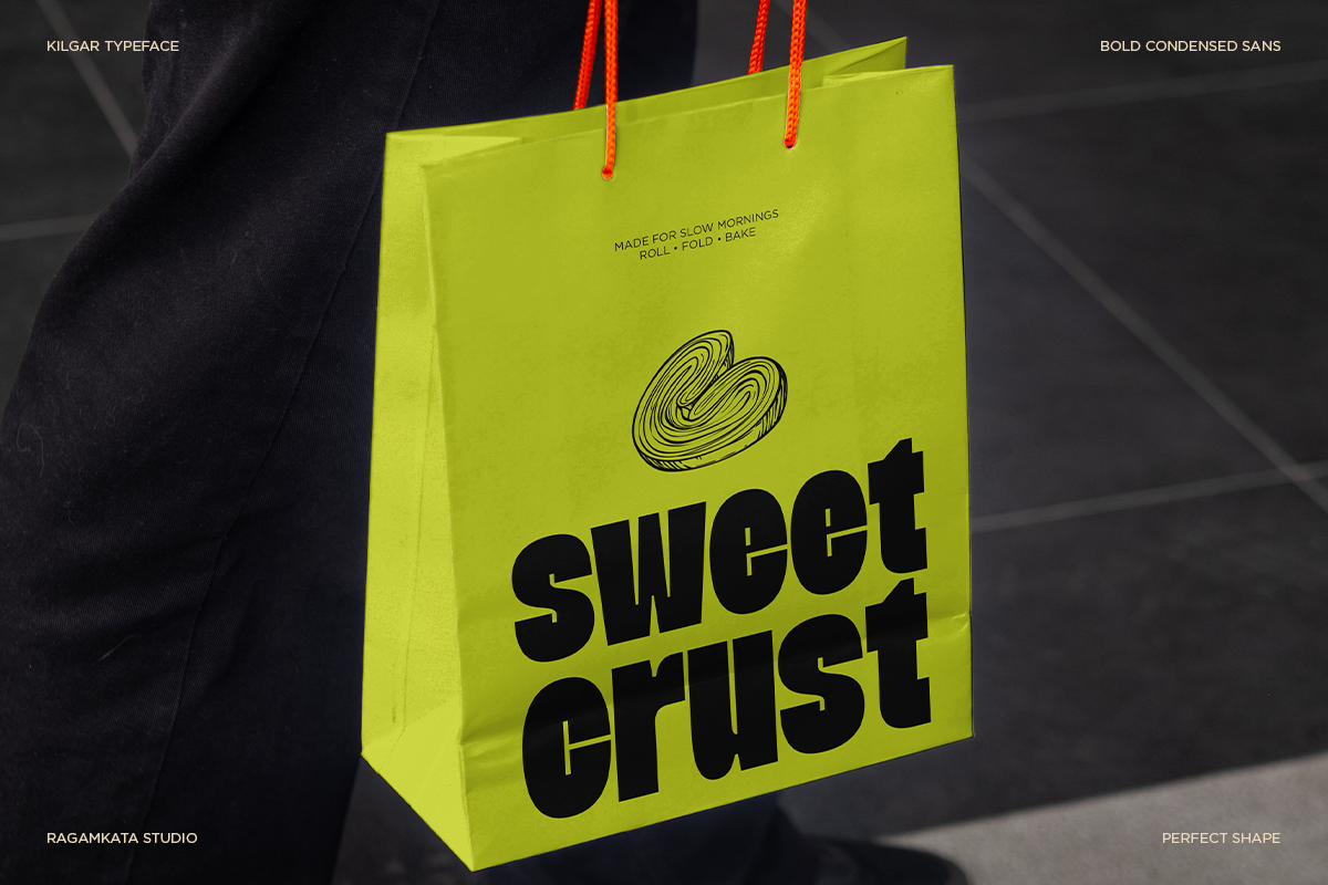 Bright neon yellow paper bag mockup with red rope handles, black bold sans serif text reading "sweet crust"