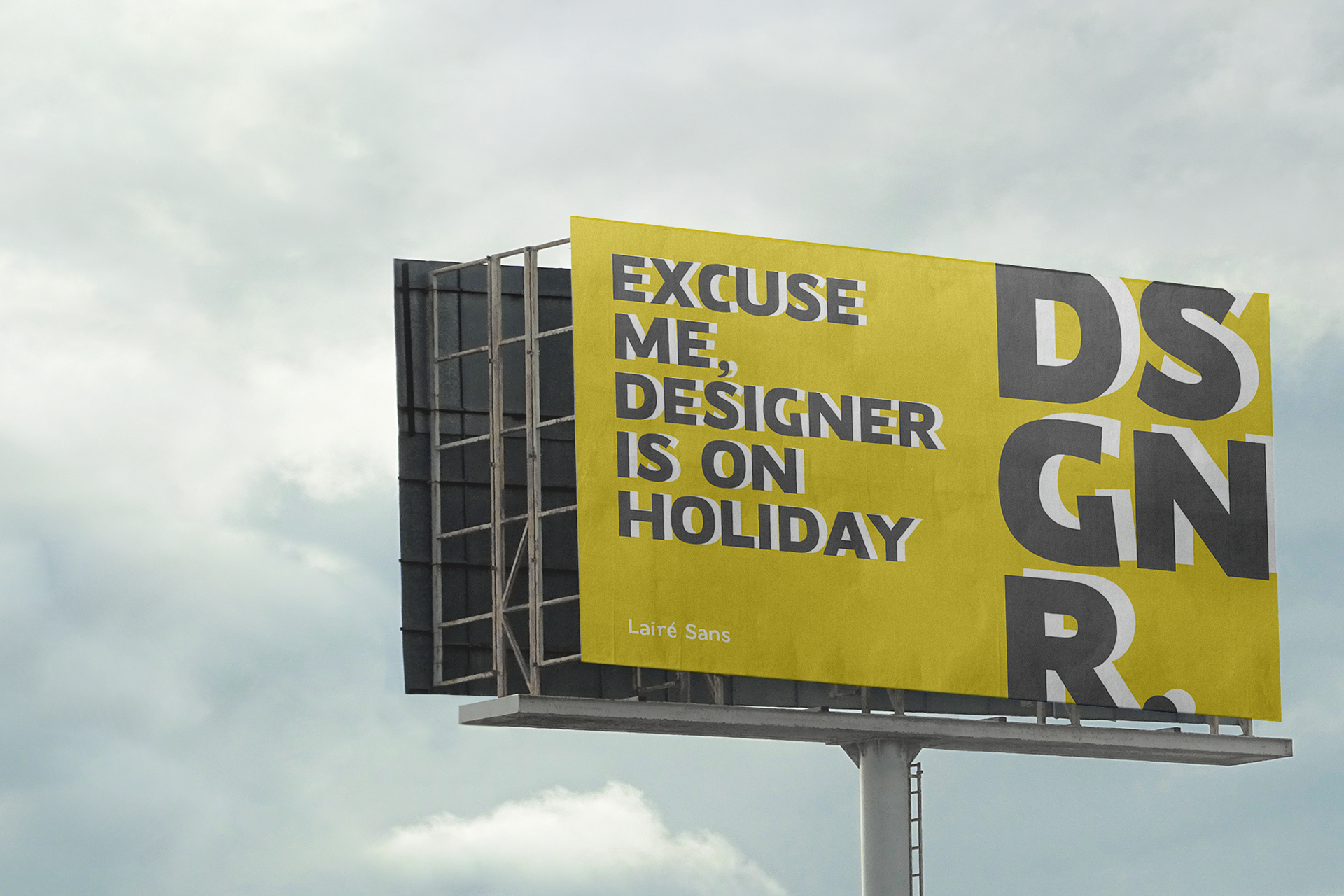 Bold yellow billboard mockup with cheeky message about designer being on holiday, Laire Sans font shown