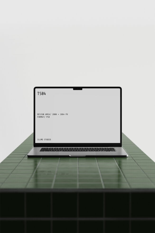 Laptop mockup on green tile surface with minimalist workspace vibe