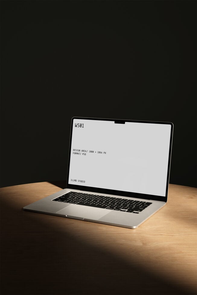 MacBook Pro mockup on wooden desk with blank screen showing specs