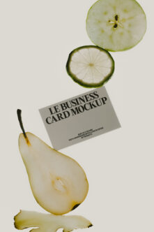 Business card mockup with lime slices, pear half, fresh ginger on clean white background