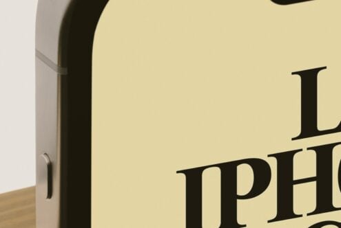 Cream box mockup with black serif typography on soft yellow background, angled view showing edge detail