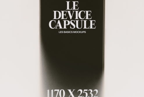 Sleek dark phone mockup with clean serif typography for Le Device Capsule