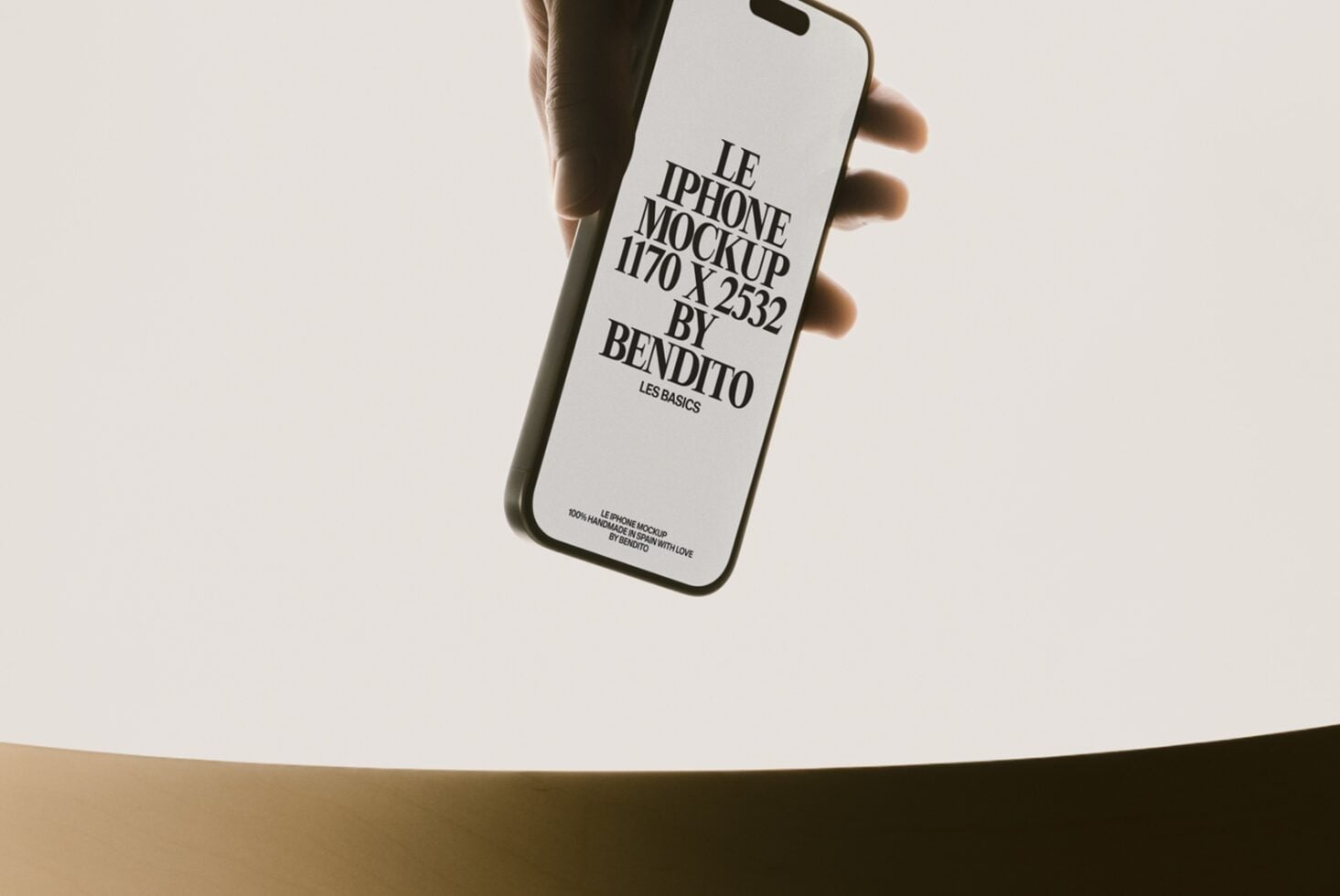 Hand holding white iPhone with black text layout mockup displayed on screen