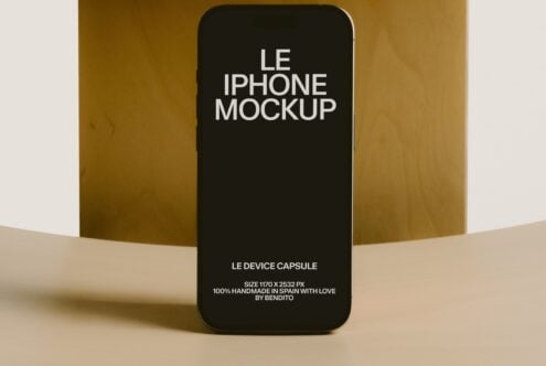 iPhone mockup on warm gold backdrop with cream surface, black screen ready for custom design