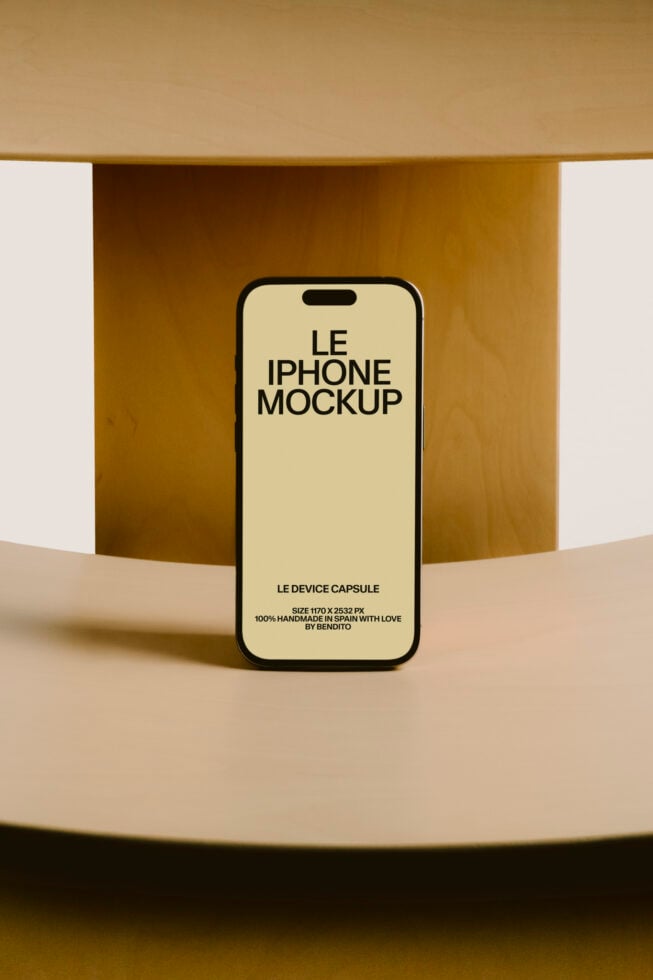 iPhone 14 Pro mockup on cream display with gold curved backdrop