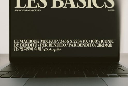 MacBook mockup displaying multilingual text on dark screen with keyboard visible