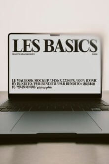 MacBook mockup showing Les Basics branding with multilingual text on screen