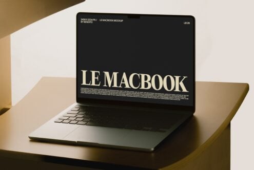MacBook mockup on warm-lit desk showing customizable screen display