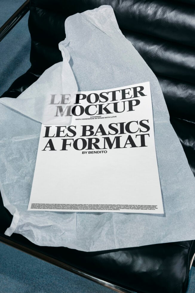 Folded poster mockup on black leather chair with tissue paper wrapping