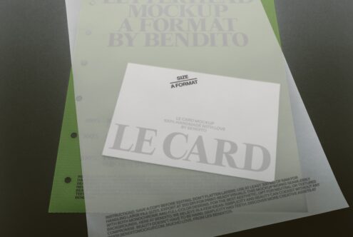 Business card mockup on cream paper with bright green accent spine, displaying sample text layout