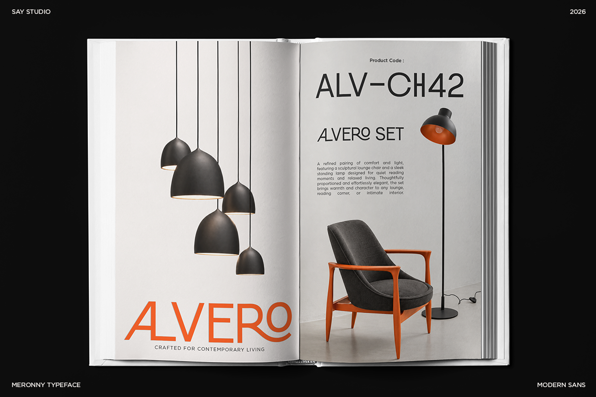 Open magazine spread showing Alvero furniture line with black pendant lights, orange wood chair, floor lamp against minimal white background