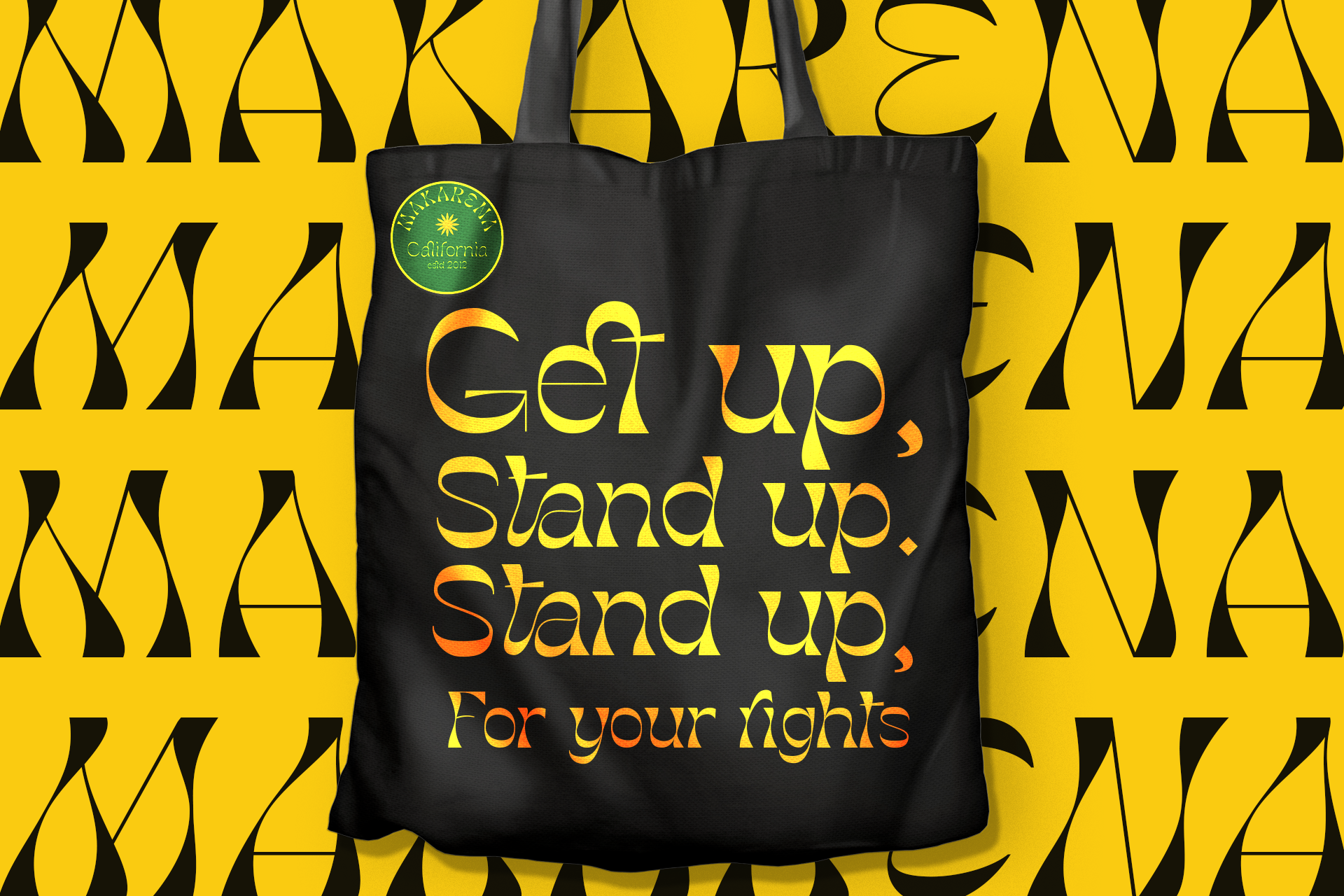 Black tote bag with yellow motivational text on bright yellow bottle pattern background