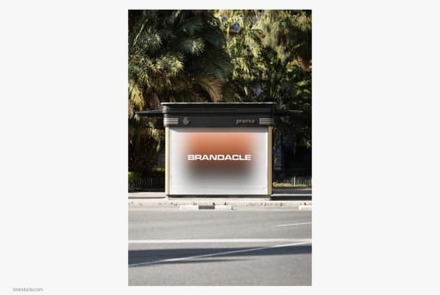 Outdoor street billboard mockup with Brandacle logo glowing against palm trees