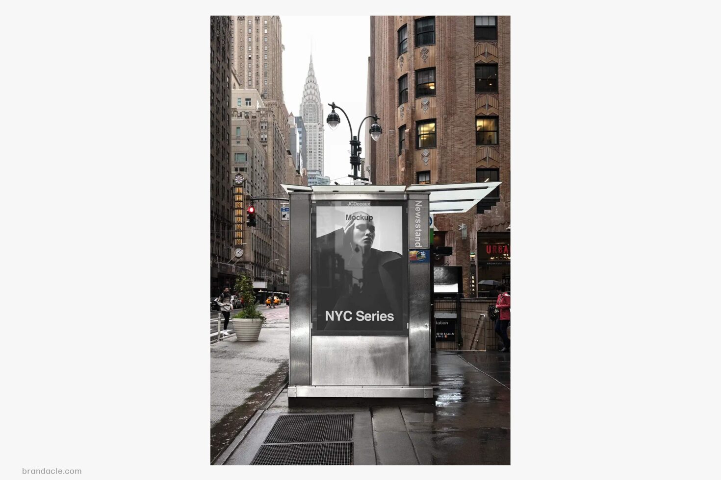 Street-level NYC advertising kiosk mockup with Chrysler Building framed behind it