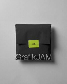 Black envelope package mockup with lime green label closure on white background