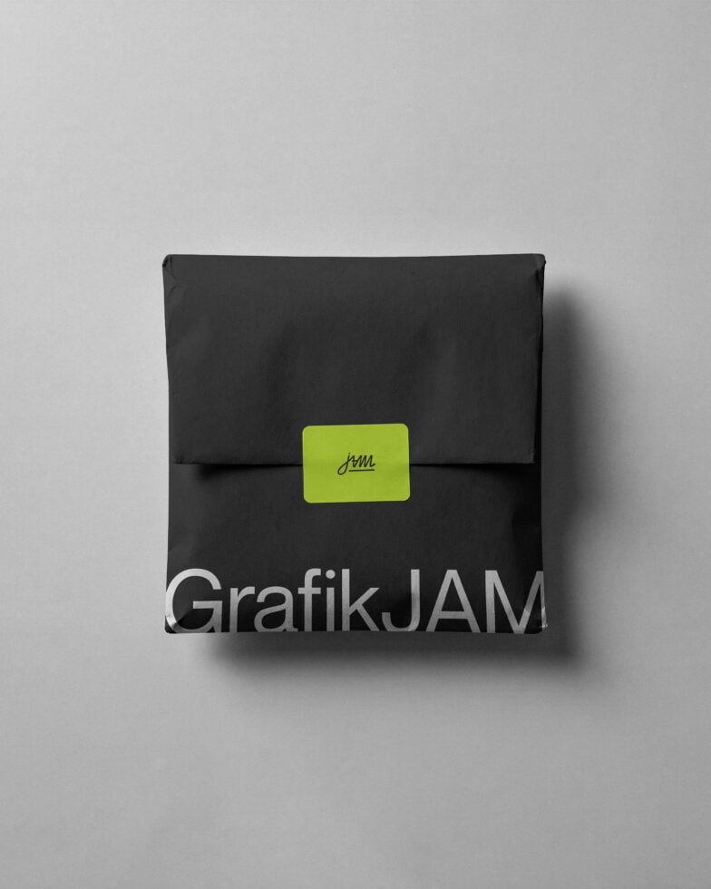 Black envelope package mockup with lime green label closure on white background
