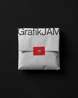 Folded white envelope mockup with GrafikJAM branding, red seal label on dark background