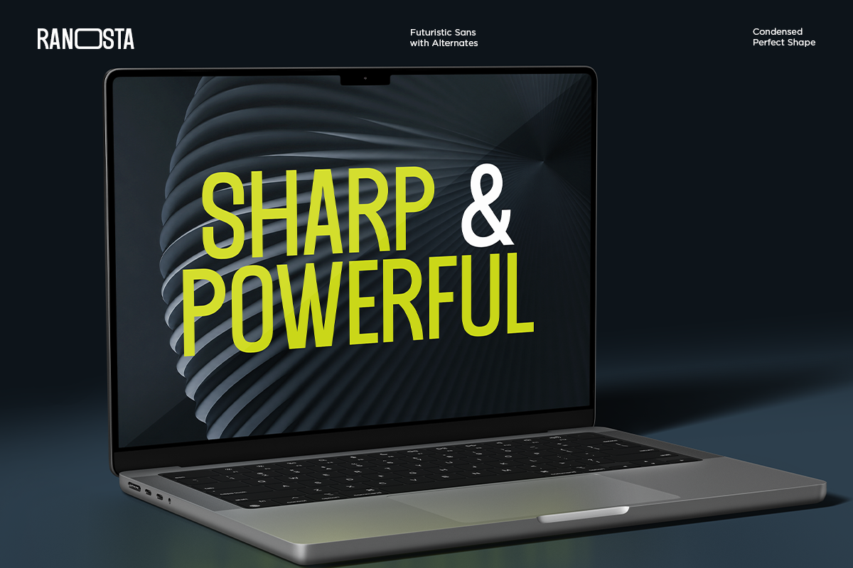 Laptop mockup displaying bold yellow sans serif font with white ampersand on dark textured background
