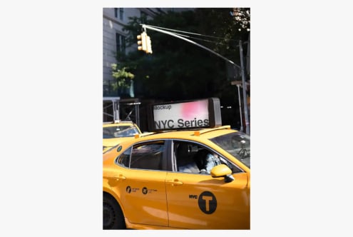 NYC taxi with digital billboard mockup mounted on roof, street scene