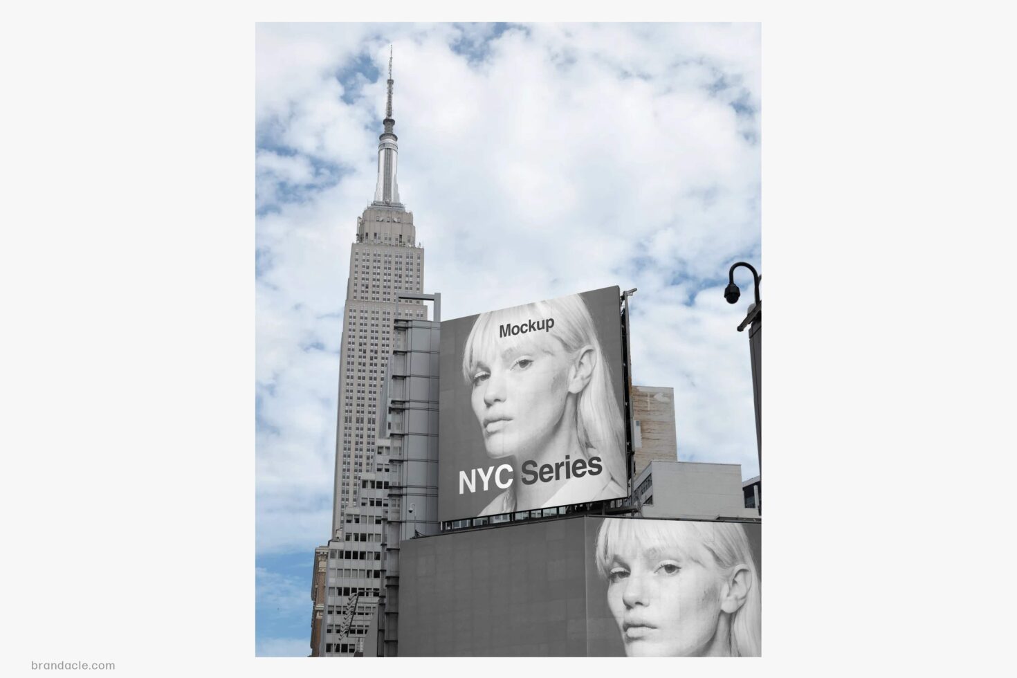 Street-level billboard mockup with portrait imagery against NYC skyline with Empire State Building