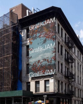 Large format billboard mockup on urban building with autumn foliage design