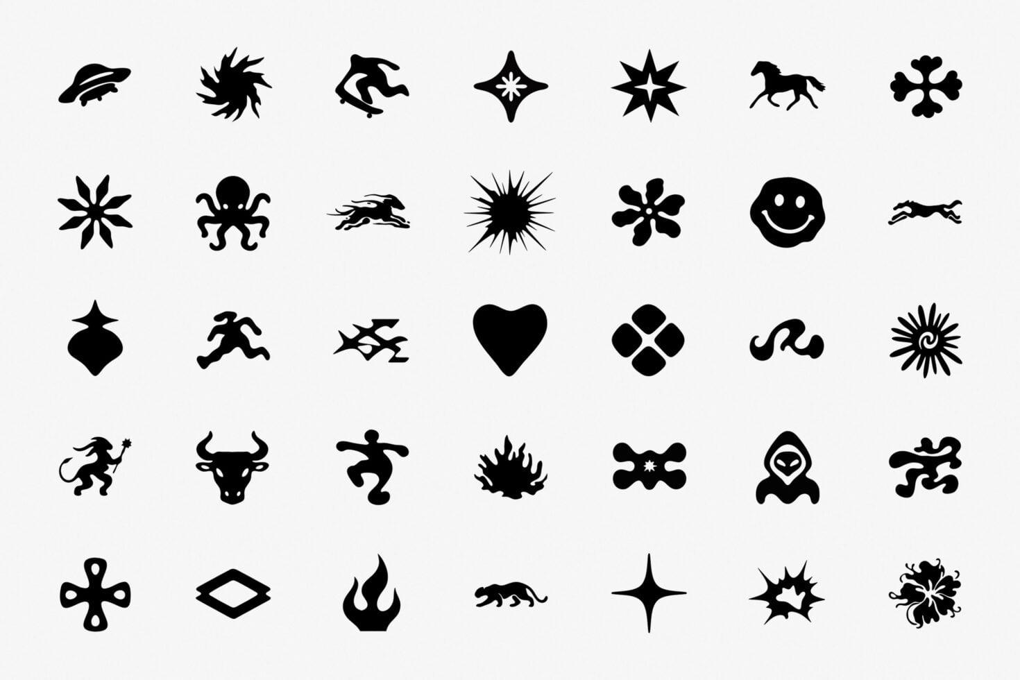 35 black silhouette icons with animals, stars, geometric shapes, smiley face, hearts, fire