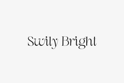 Swirly Bright serif font with elegant flowing letterforms on cream background