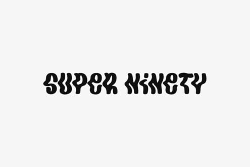 Super Nineity bold wavy typeface in black on light gray background