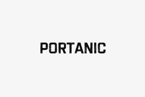 Portanic distressed typeface with grungy texture on light background