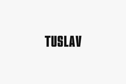 Bold sans serif typeface with tight letter spacing on light background
