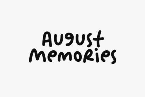 Hand-drawn text reading "August Memories" in black marker on light gray background