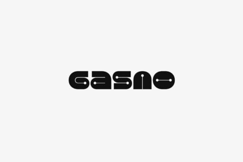 Bold geometric typeface with tech-inspired cutouts on light background