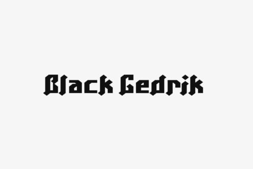 Black Gedrik gothic typeface with sharp angular letterforms on light background
