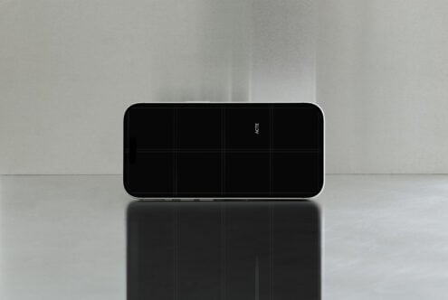 iPhone 14 Pro Max landscape mockup with black screen on minimal gray backdrop