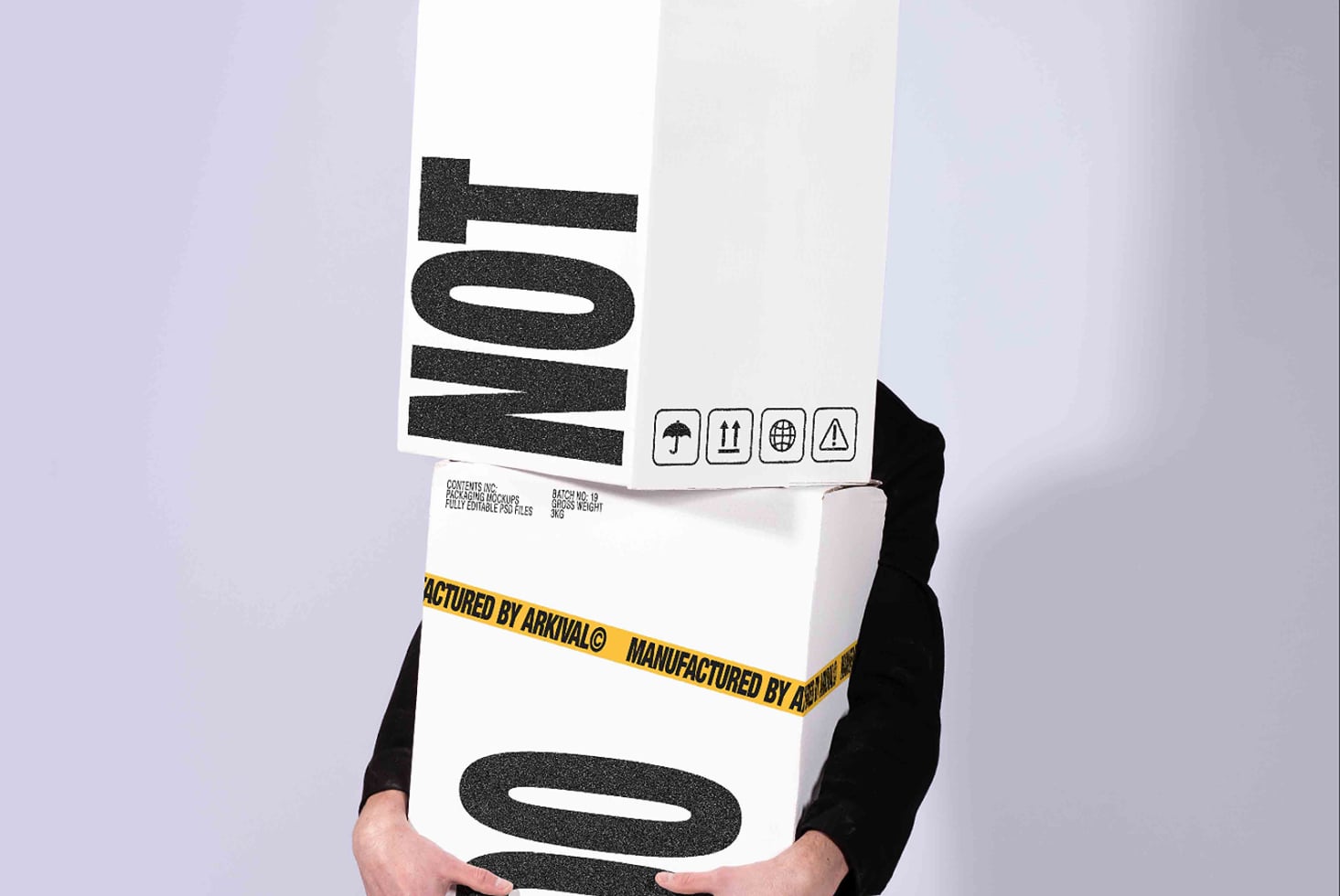Hands holding stacked product boxes with bold black typography, shipping icons, plus yellow caution tape mockup
