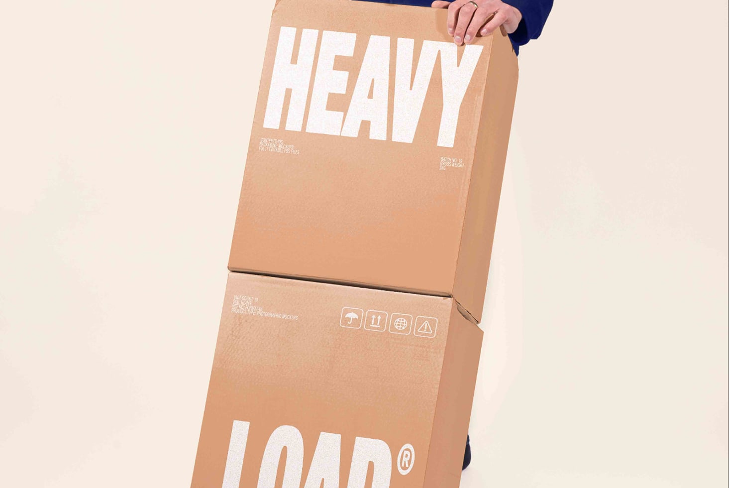 Person holding stacked cardboard boxes with bold white typography for heavy load shipping mockup