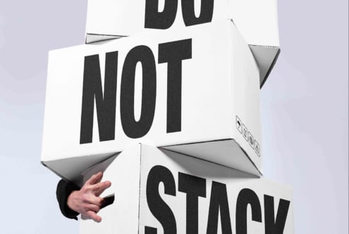 Do not stop 3D box mockup with folded flaps, hand holding corner, bold typography