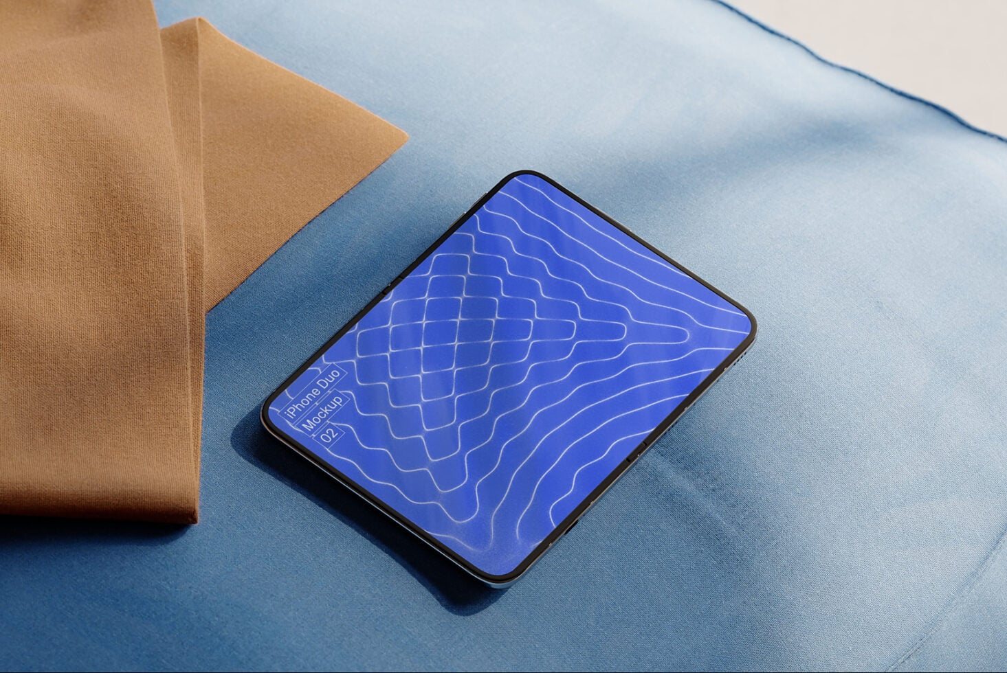 Phone duo mockup v2 with wavy blue pattern on fabric backdrop with tan cloth