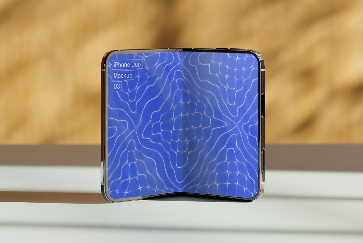 Folded iPhone Duo displaying blue topographic pattern on screen in natural daylight