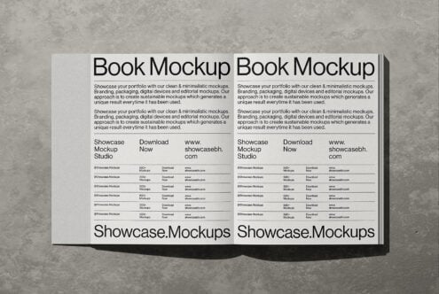 Open book mockup spread showing clean minimal design layouts with text blocks, download buttons, plus concrete background