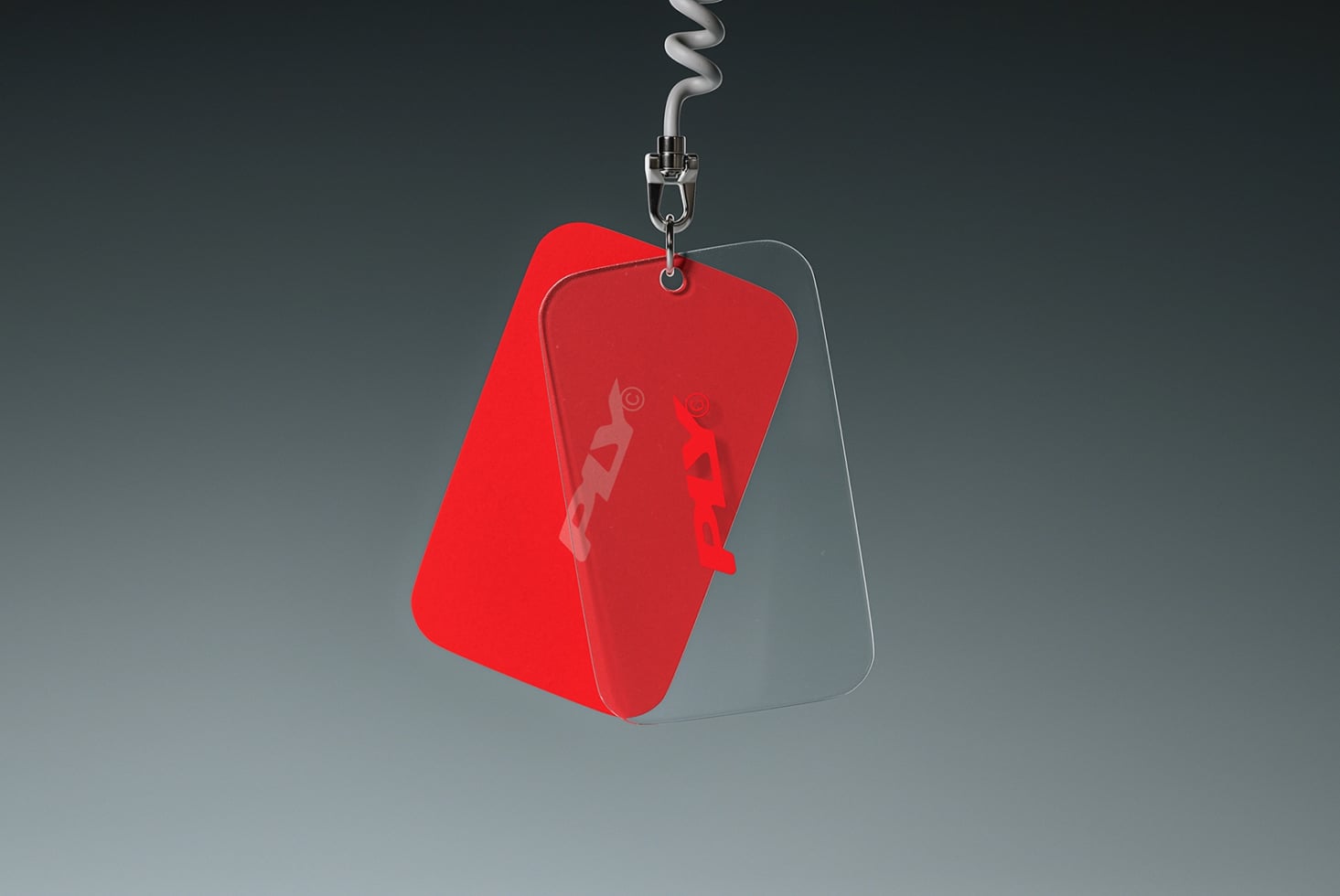 Bright red badge mockup with translucent layers hanging from metal clasp on coiled cord