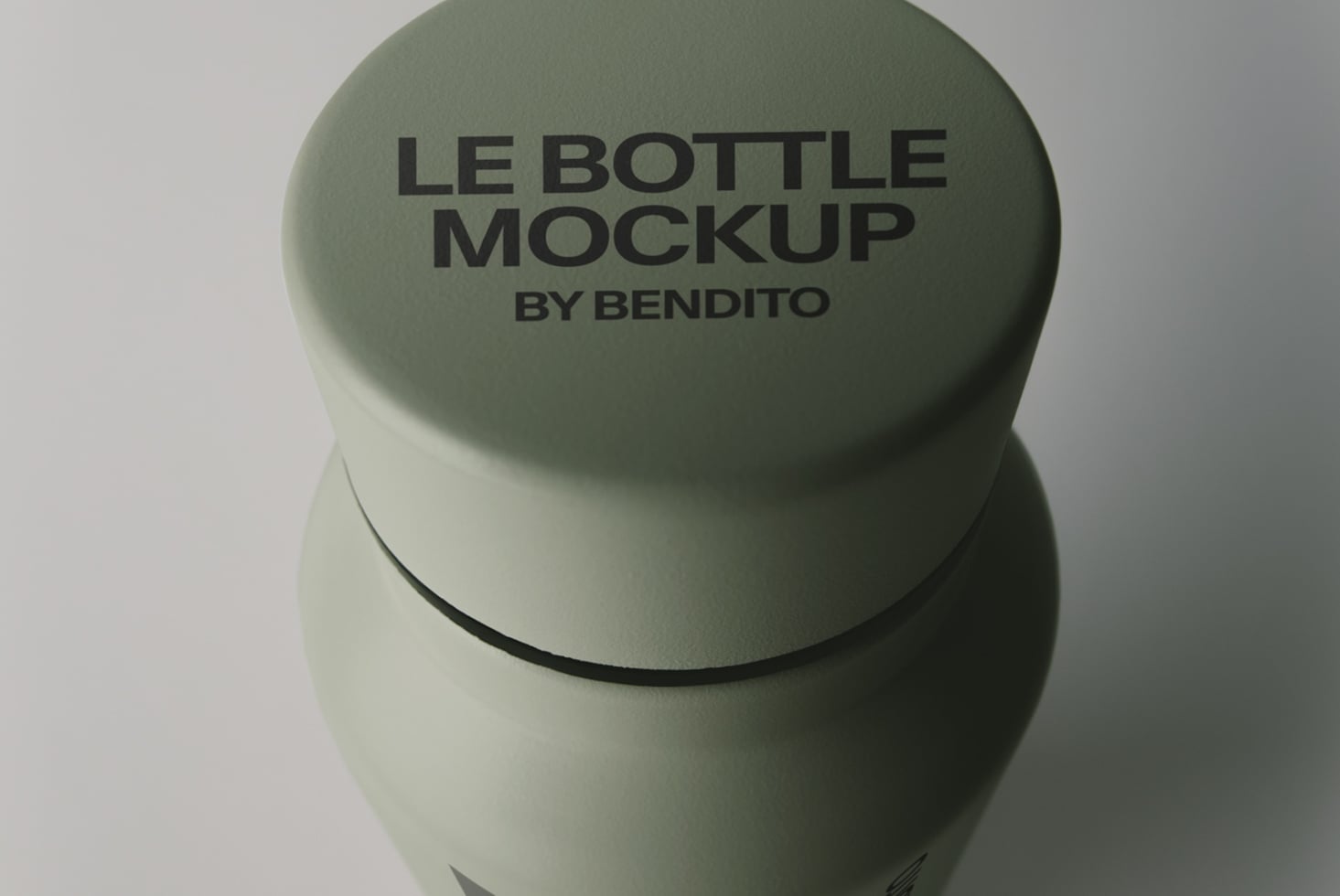 Sage green cosmetic bottle with embossed cap text shown from overhead angle