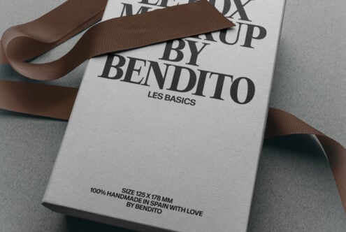 Luxury box packaging mockup with brown grosgrain ribbon, serif typography, Les Basics branding, handmade in Spain details visible