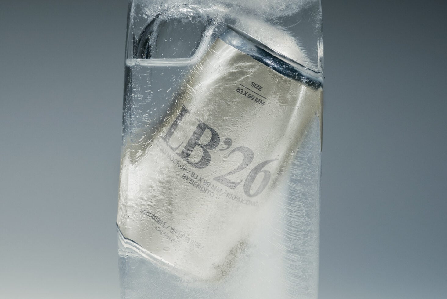 Frosted glass bottle with condensation, label showing size specs, product mockup shot from above