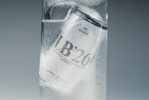 Frosted water bottle mockup with condensation, label showing size 83x98mm by Bendito