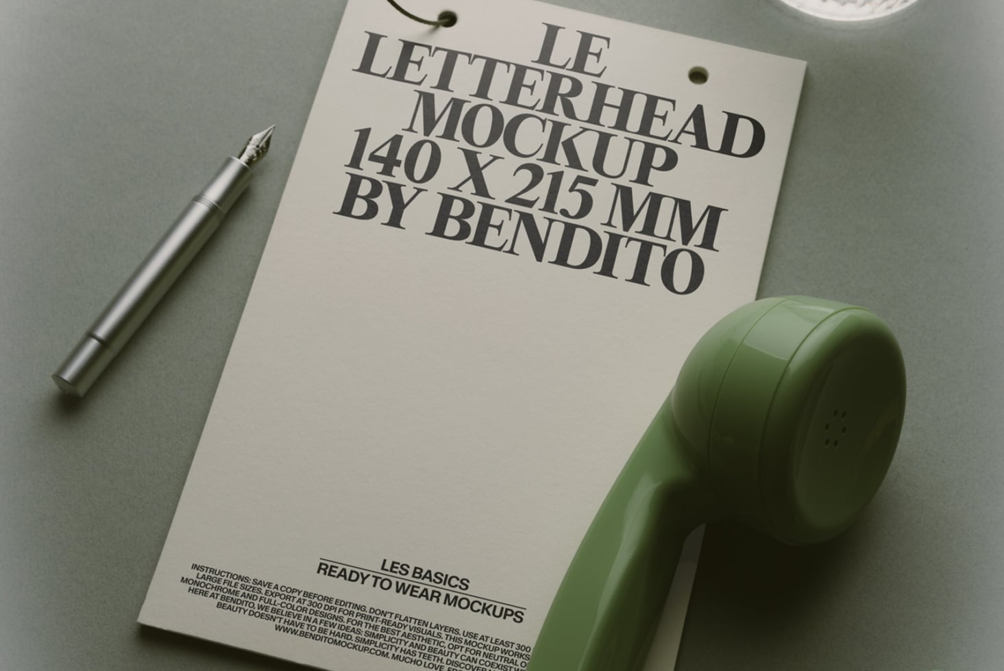 Letterhead mockup 140x215mm with silver pen, green ceramic pot, minimal styling on gray