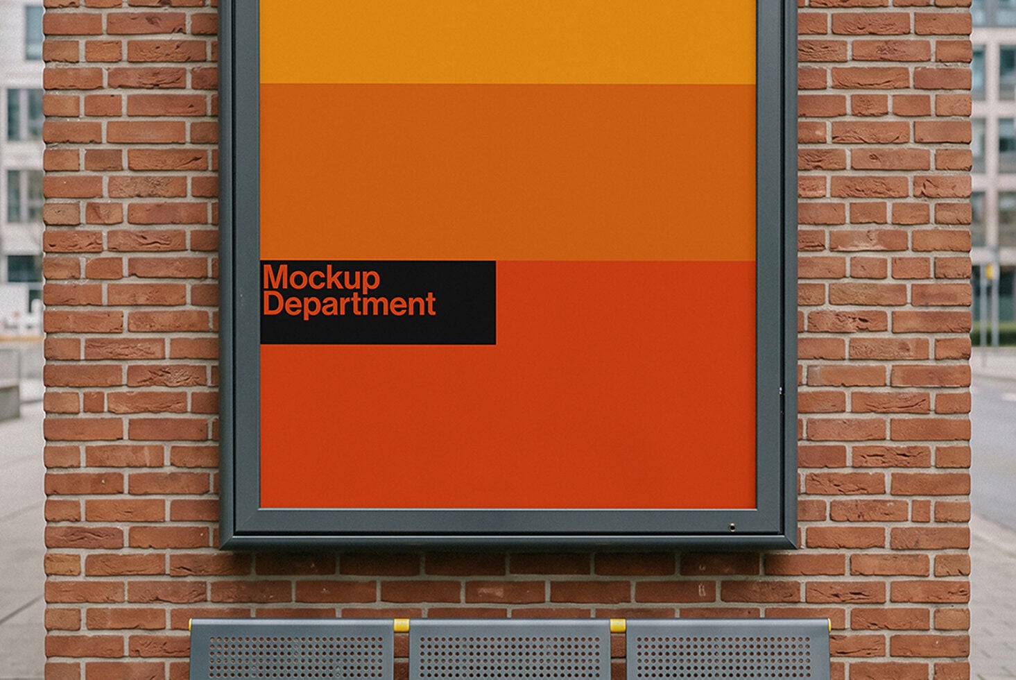 Orange storefront window display with Mockup Department branding on brick wall
